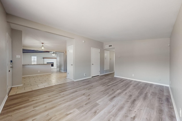 unfurnished living room featuring light wood-type flooring