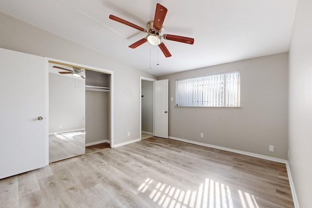 unfurnished bedroom featuring light hardwood / wood-style floors, a closet, and ceiling fan