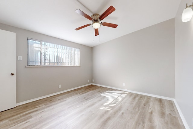 spare room with ceiling fan and light hardwood / wood-style flooring