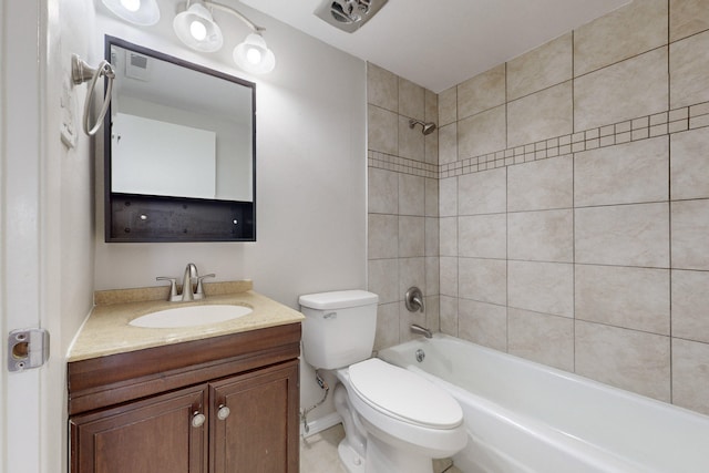 full bathroom featuring tiled shower / bath combo, vanity, and toilet