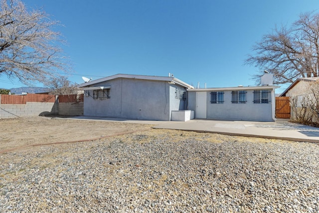 back of property featuring a patio