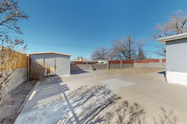 view of patio with a shed