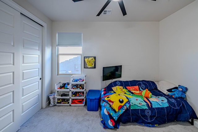 bedroom featuring light colored carpet and ceiling fan