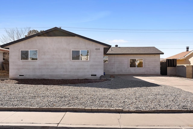 exterior space featuring roof with shingles, crawl space, a patio area, and stucco siding