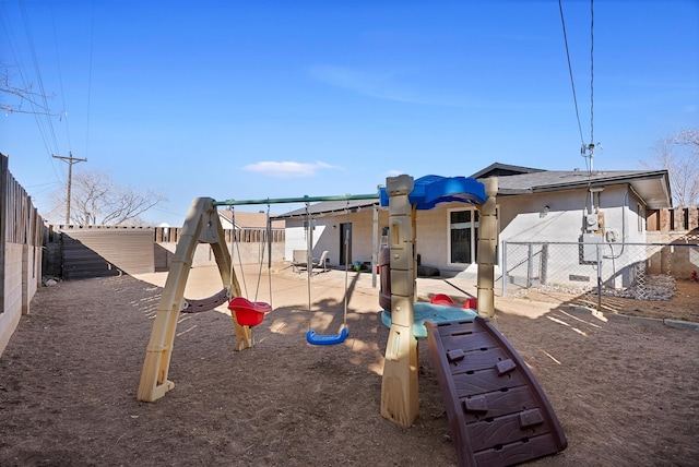 view of playground with a patio