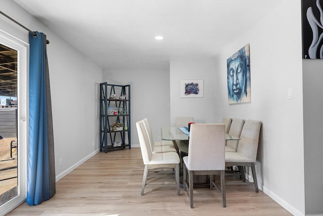 dining space with light wood-type flooring