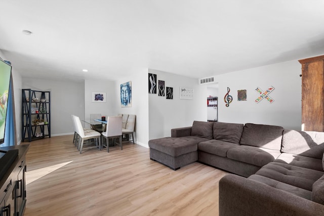 living room with light hardwood / wood-style floors