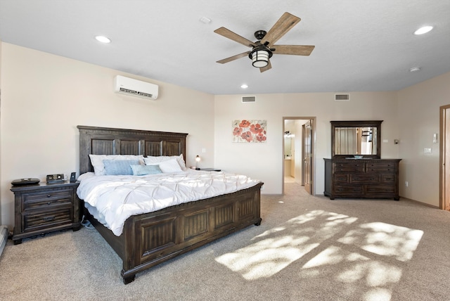 carpeted bedroom with an AC wall unit and ceiling fan