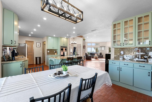 dining area with a textured ceiling