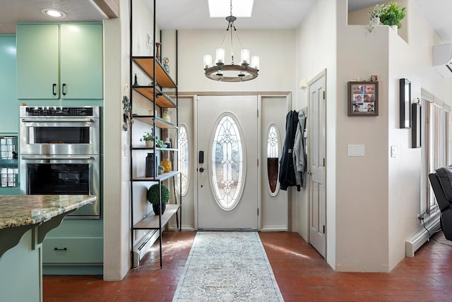 entryway featuring a chandelier