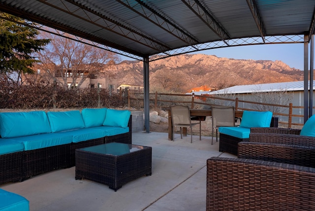 view of patio with outdoor lounge area and a mountain view