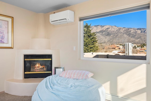 bedroom featuring an AC wall unit, carpet floors, and a mountain view