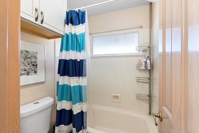 bathroom featuring toilet and shower / bath combo