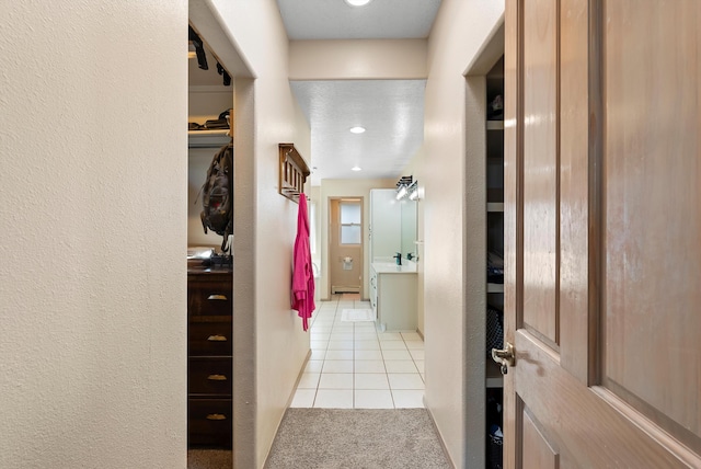 hall with light tile patterned flooring