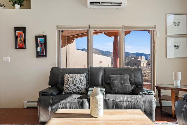 living room with a baseboard radiator, a mountain view, and a wall mounted AC