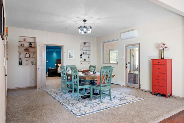 dining space with built in features, an AC wall unit, a textured ceiling, and carpet