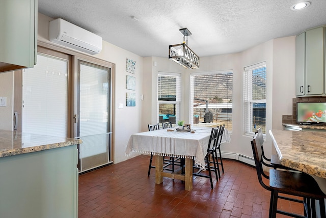 dining space featuring a baseboard radiator, an AC wall unit, a wealth of natural light, and a textured ceiling