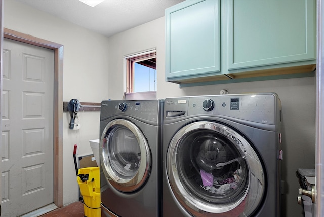 laundry area featuring cabinets and independent washer and dryer