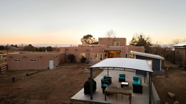 exterior space featuring an outdoor living space and a patio area