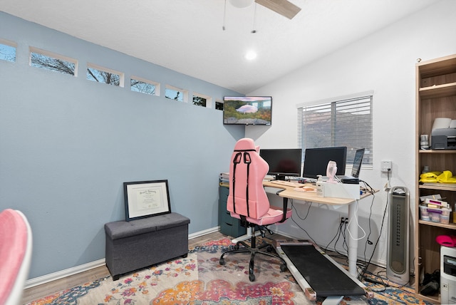 office space featuring hardwood / wood-style flooring, vaulted ceiling, and ceiling fan