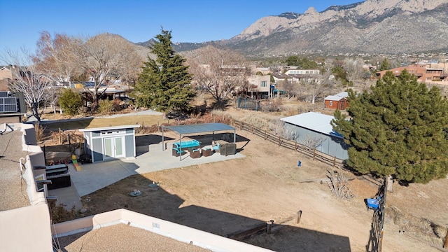 drone / aerial view featuring a mountain view