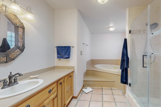 bathroom with vanity, tile patterned flooring, and independent shower and bath