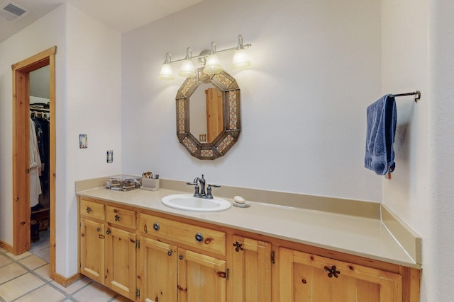 bathroom with vanity and tile patterned flooring