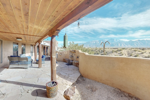 view of patio / terrace featuring outdoor lounge area and a mountain view