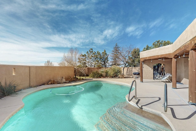 view of swimming pool featuring a patio area