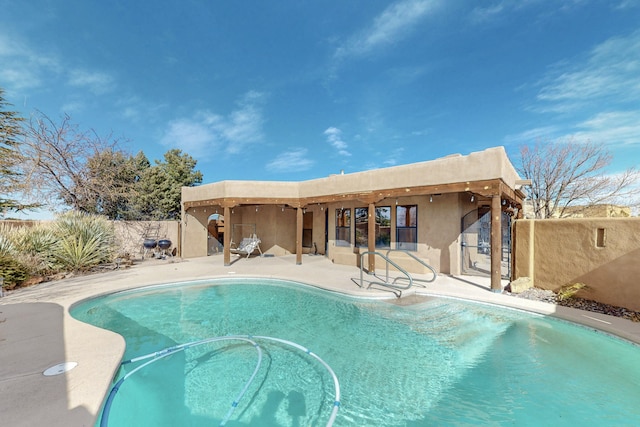 view of swimming pool with a patio area