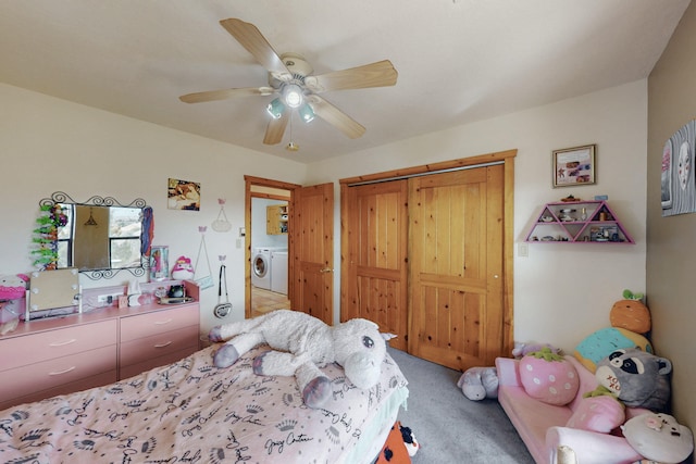 carpeted bedroom with washer / clothes dryer, a closet, and ceiling fan