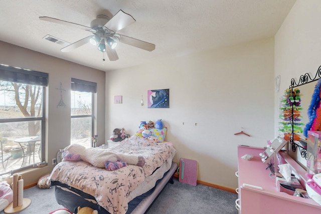 bedroom featuring carpet floors, a textured ceiling, and ceiling fan