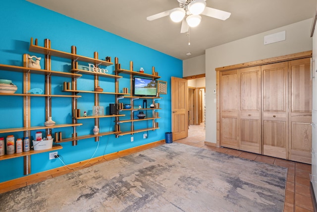 unfurnished bedroom with light tile patterned floors and a closet