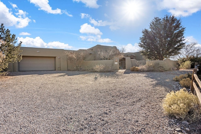 southwest-style home with a garage