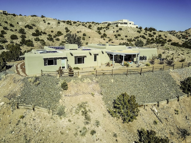 rear view of property with a mountain view