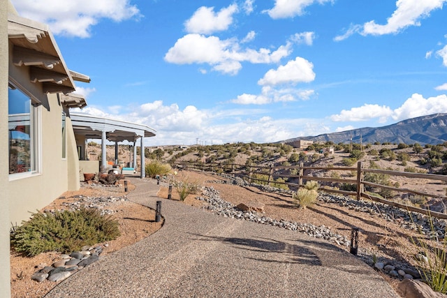 view of yard with a mountain view and a patio