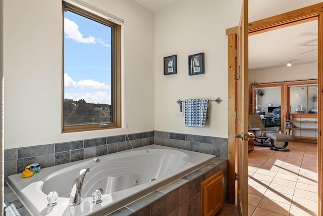 bathroom featuring tile patterned floors and tiled bath