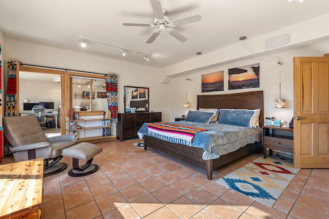 bedroom featuring tile patterned floors and ceiling fan