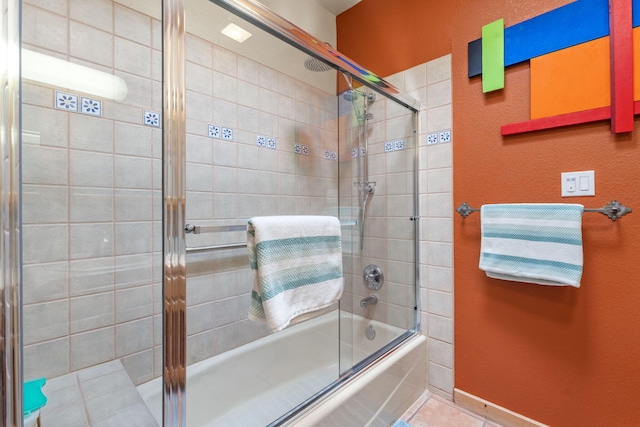 bathroom with tile patterned flooring and enclosed tub / shower combo