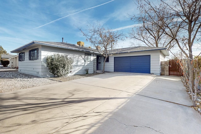 ranch-style house featuring a garage