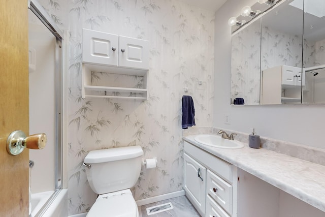 full bathroom with bath / shower combo with glass door, vanity, and toilet