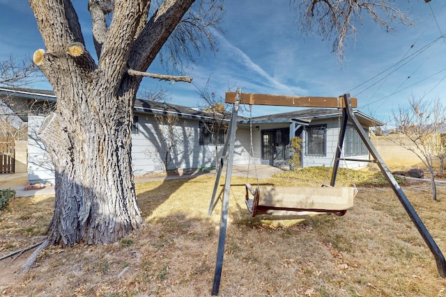 rear view of house with a lawn