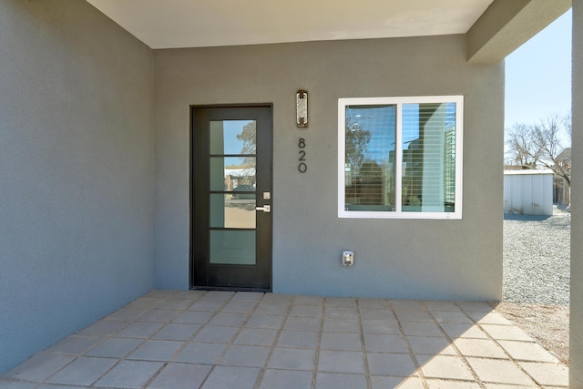 entrance to property with a patio area