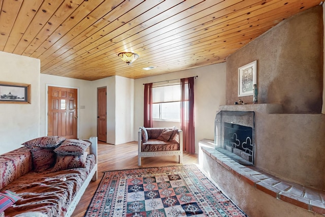 living room featuring wooden ceiling and light wood-type flooring