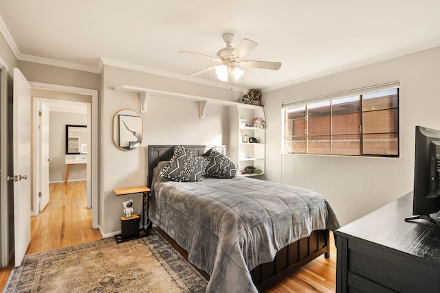 bedroom featuring crown molding, ceiling fan, and light hardwood / wood-style floors