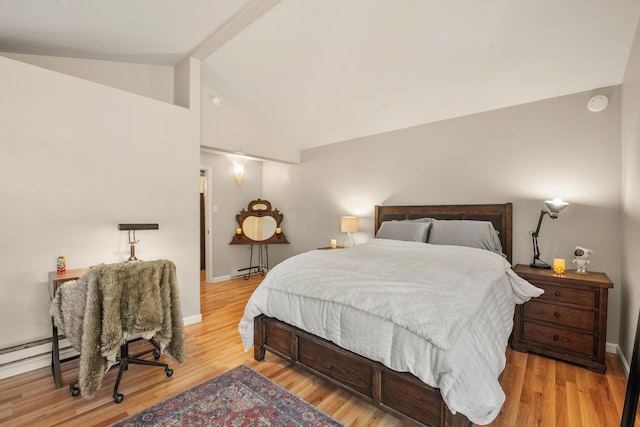 bedroom with light hardwood / wood-style flooring and vaulted ceiling