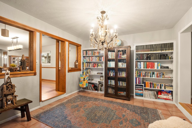 living area with tile patterned flooring and a notable chandelier