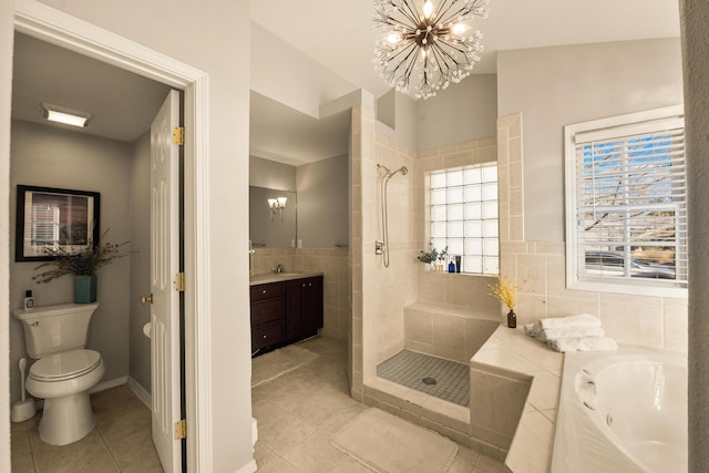 full bathroom featuring tile walls, tile patterned flooring, an inviting chandelier, vanity, and independent shower and bath