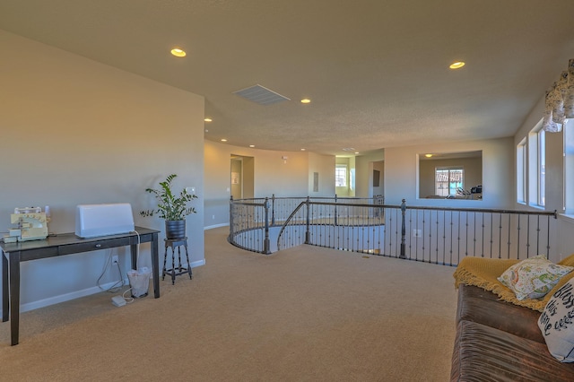 interior space featuring carpet and a healthy amount of sunlight