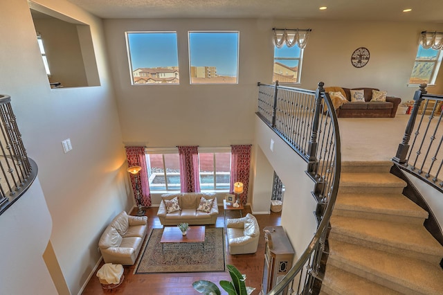 living room with a towering ceiling